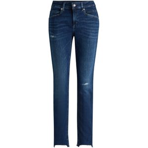 Blauwe jeans van distressed stretchdenim met gerafelde zomen