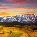 Fotobehang - Besneeuwde bergen bij zonsondergang, premium print, inclusief behanglijm