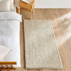 Bedmatje in dikke wol, handgeweven, Nisha AM.PM. Wol materiaal. Maten 80 x 150 cm. Beige kleur