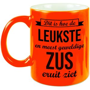 Leukste en meest geweldige zus cadeau mok / beker neon oranje 330 ml