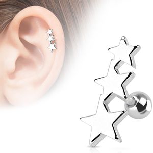 Helix piercing met drie zilveren sterren