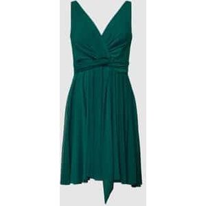 Cocktailjurk in wikkellook