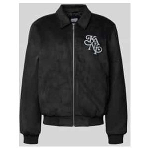 Jack in leerlook met labelstitching