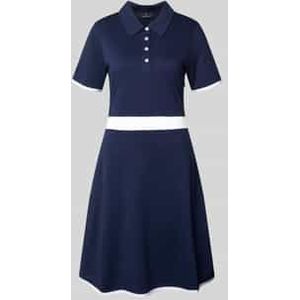 Knielange polojurk met korte knoopsluiting