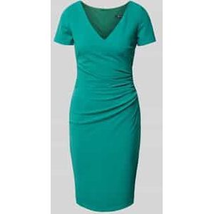 Knielange cocktailjurk met plooien opzij