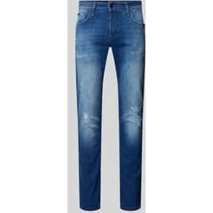 Tapered fit jeans in destroyed-look