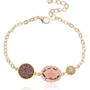 Goudkleurige verstelbare dames armband met roze glassteen
