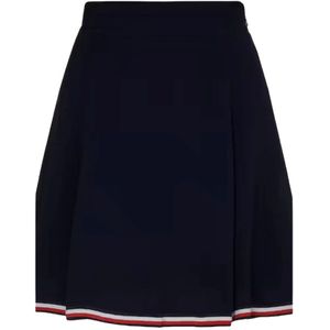 Tommy Hilfiger, Rokken, Dames, Blauw, L, Regular Fit Klokkende Rok. De elegante klokkende rok is afgewerkt met een iconisch lintdetail aan de onderkant, wat een verfijnde kleurnoot toevoegt.