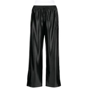 Alexander Wang, Broeken, Dames, Zwart, M, Polyester, Zwarte track pants met geïntegreerde slip en gestapelde Wang-puff