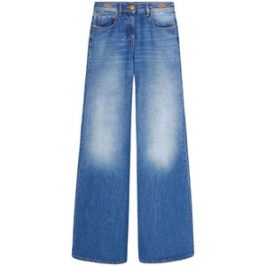 Versace, Blauwe Gewassen Denim met Goudkleurige Logo Plaque Blauw, Dames, Maat:W26