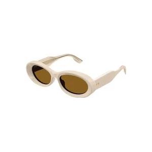 Gucci Stijlvolle ovale zonnebril met iconische rivetten , Beige , unisex , Maat: 54 MM