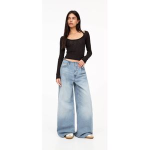 Jeans Met Wijde Pijpen En Gerafelde Tailleband