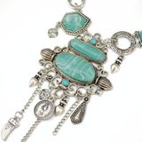 Overdreven opengewerkt patroon met turquoise legering stenen ketting