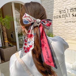 2 STKS QC30162 Elegante Parel Boog Streamer Vastgebonden Haar Touw Haarbanden (Rode Bloemen)