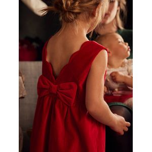 Feestjurk van glad fluweel met een strik op de rug rood