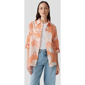 Lichtoranje blouse met witte bloemenprint