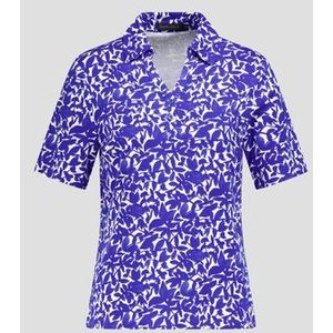 Ecru polo met blauwe bladerprint