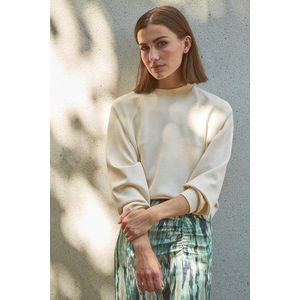 Zacht lichtbeige truitje