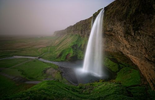 Papermoon Fototapete »Photo-Art WILLY MARTHINUSSEN, WASSERFALL IN DER LANDSCHAFT«