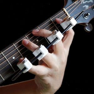 Vier vingers vinger Expander gitaar ukulele piano span praktijk vinger cover  specificatie: kinderen editie (wit)