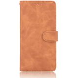 For iPhone 12 Pro Max Solid Color Skin Feel Magnetic Buckle Horizontal Flip Calf Texture PU Leather Case with Holder & Card Slots & Wallet(Brown)