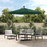 <p>Deze elegante hangende parasol is de perfecte keuze om wat schaduw te creëren en jezelf te beschermen tegen de schadelijke UV-straling van de zon.</p>
<p>Wanneer de zon ondergaat, verlichten de atmosferische, op zonne-energie werkende LED's automatisch je buitenruimte.</p>
<p>De grote luifel heeft een diameter van 300 cm en is gemaakt van UV-bestendig en kleurvast polyester stof.</p>
<p>De sterke metalen paal, ribben (8) en kruisvoet maken de parasol zeer stabiel en duurzaam.</p>
<p>De luifel hangt vrij van de paal, zodat de ruimte onder de parasol onbelemmerd blijft.</p>
<p>De tuinparasol kan eenvoudig geopend en gesloten worden dankzij het zwengelmechanisme.</p>
<p>De geïntegreerde 24 LED-lampen, aangedreven door 1 zonnepaneel, creëren 's nachts een gezellige en romantische sfeer.</p>
<p>Montage is eenvoudig.</p>
<ul>
  <li>Kleur: groen</li>
  <li>Materiaal parasoldoek: stof (waterdicht, uv-bestendig en kleurvast)</li>
  <li>Materiaal frame: metalen paal en ribben (8)</li>
  <li>Diameter doek: 300 cm</li>
  <li>Totale hoogte: 254 cm</li>
  <li>Afmetingen kruisvoet: 100 x 100 cm (L x B)</li>
  <li>Met luchtventilatie en zwengelmechanisme</li>
  <li>Inclusief 24 LED-lampjes en 1 zonnepaneel</li>
  <li>Oplaadtijd van het zonnepaneel: 8 uur (op zonnige dagen)</li>
  <li>Brandtijd van de LED's: 4 uur</li>
  <li>Vermogen van het zonnepaneel: 0,7 W</li>
  <li>Eenvoudig te monteren</li>
  <li>Materiaal: Polyester: 100%</li>
</ul>