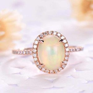 Huitan Gesimuleerde Opal Engagement Ring Voor Vrouwen Met Micro Verharde Rose Goud Kleur Ovale Opaal Ringen Voor Vrouwelijke ring