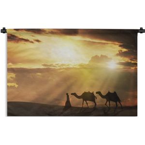 Wandkleed Kameel - Arabische man en kamelen zonsondergang Wandkleed katoen 150x100 cm - Wandtapijt met foto