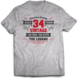 34 Jaar Legend - Feest kado T-Shirt Heren / Dames - Antraciet Grijs / Rood - Perfect Verjaardag Cadeau Shirt - grappige Spreuken, Zinnen en Teksten. Maat XXL