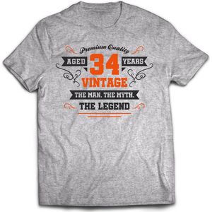 34 Jaar Legend - Feest kado T-Shirt Heren / Dames - Antraciet Grijs / Oranje - Perfect Verjaardag Cadeau Shirt - grappige Spreuken, Zinnen en Teksten. Maat XXL