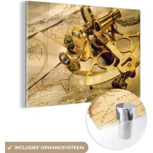 MuchoWow® Glasschilderij 180x120 cm - Schilderij acrylglas - Een sextant om mee te navigeren bovenop wereldkaarten - Foto op glas - Schilderijen