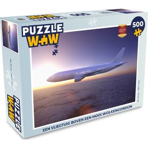 Puzzel Een vliegtuig boven een mooi wolkengordijn - Legpuzzel - Puzzel 500 stukjes