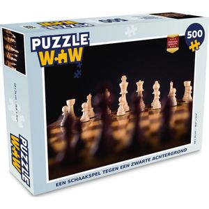 Puzzel Een schaakspel tegen een zwarte achtergrond - Legpuzzel - Puzzel 500 stukjes