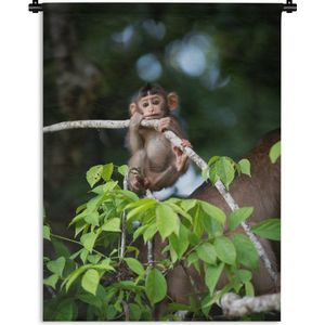 Wandkleed Junglebewoners - Jonge aap hangend aan tak Wandkleed katoen 90x120 cm - Wandtapijt met foto