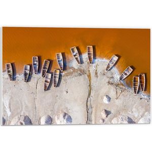 WallClassics - PVC Schuimplaat- Bovenaanzicht van Oude Houten Vissersboten aan Oranje Getinte Zee - 60x40 cm Foto op PVC Schuimplaat