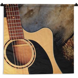 Wandkleed Akoestische gitaar - Een akoestische gitaar op een houten ondergrond Wandkleed katoen 150x150 cm - Wandtapijt met foto