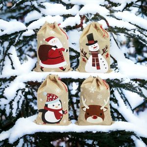 Kerst Jute-linnen goody-cadeauzakjes met trekkoord. 4 ontwerpen Kerstman Sneeuwpop Rendier Pinguïn. Pakket van 4