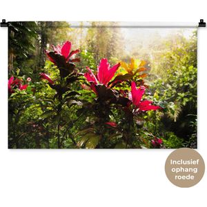 Wandkleed Jungle - Prachtige bloemen middenin de jungle Wandkleed katoen 90x60 cm - Wandtapijt met foto