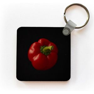 Sleutelhanger - Uitdeelcadeautjes - Een rode paprika op een zwarte achtergrond - Plastic