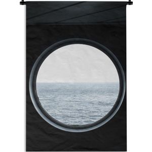 Wandkleed Uitzicht - Uitzicht op de zee door een rond raam Wandkleed katoen 120x180 cm - Wandtapijt met foto XXL / Groot formaat!