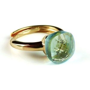 Ring in zilver geelgoud verguld model pomellato licht blauwe steen