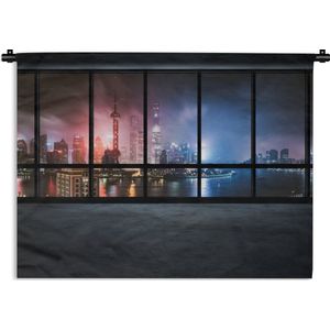 Wandkleed Uitzicht - Uitzicht vanuit een leeg kantoor op de verlichte stad in de nacht Wandkleed katoen 60x45 cm - Wandtapijt met foto