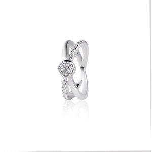 ZINZI zilveren cross-over ring ronde zetting wit ZIR1584