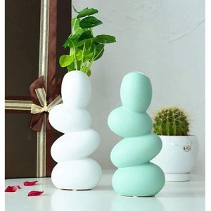 XIUWOUG Abstracte keramische ei-vaas, unieke en minimalistische decoratieve vazen, moderne sculptuur decoratie voor woonkamer (mintgroen)