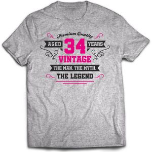 34 Jaar Legend - Feest kado T-Shirt Heren / Dames - Antraciet Grijs / Roze - Perfect Verjaardag Cadeau Shirt - grappige Spreuken, Zinnen en Teksten. Maat 3XL