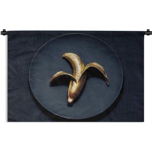 Wandkleed Goud - Gouden banaan op een donkere achtergrond Wandkleed katoen 60x45 cm - Wandtapijt met foto