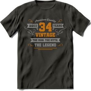 34 Jaar Legend T-Shirt | Goud - Zilver | Grappig Verjaardag Cadeau | Dames - Heren | - Donker Grijs - XL