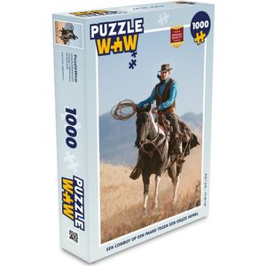 Puzzel Een cowboy op een paard tegen een grijze hemel - Legpuzzel - Puzzel 1000 stukjes volwassenen