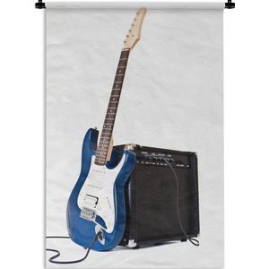 Wandkleed Elektrische gitaar - Een elektrische gitaar leunt tegen een versterker Wandkleed katoen 120x180 cm - Wandtapijt met foto XXL / Groot formaat!
