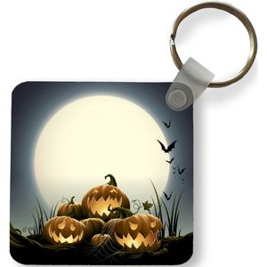 Sleutelhanger - Een illustratie van lachende pompoenen tijdens Halloween - Plastic - Rond - Uitdeelcadeautjes